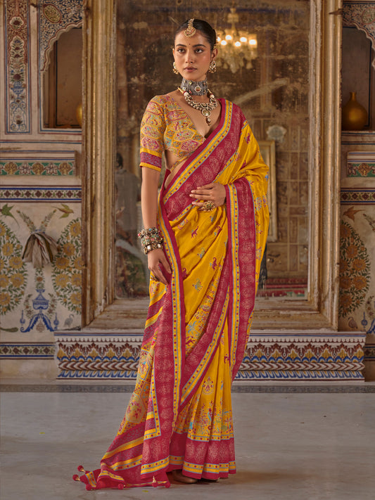 Woman wearing mustard silk blend saree with traditional indian motif work and multicolored blouse