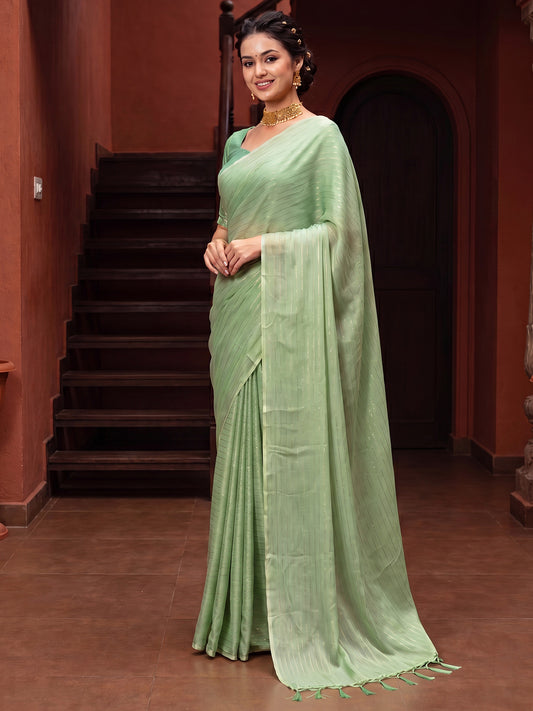 Woman wearing light green poly georgette saree with striped pattern design and mint green blouse