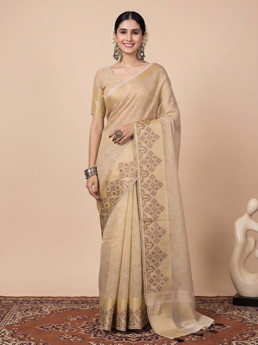 Woman wearing cream tissue saree with embroidered motif work and cream blouse