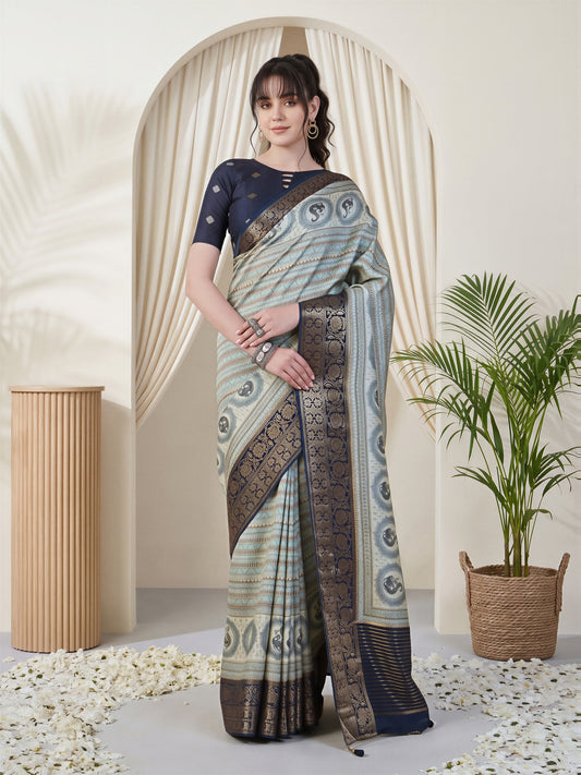 Woman wearing light blue viscose silk saree with traditional indian motif work and navy blue blouse