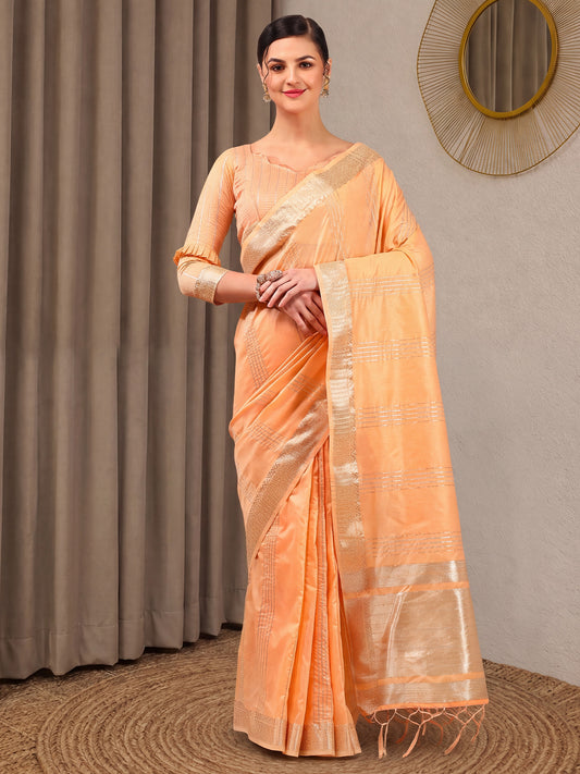 Woman wearing peach linen saree with zari butta (metallic motif) work and peach blouse