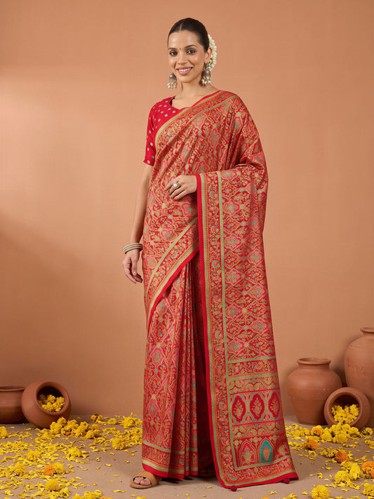 Woman wearing red silk blend saree with metallic foil print work and red blouse