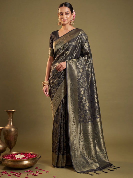 Woman wearing black kanjeevaram silk saree with traditional indian motif work and black blouse