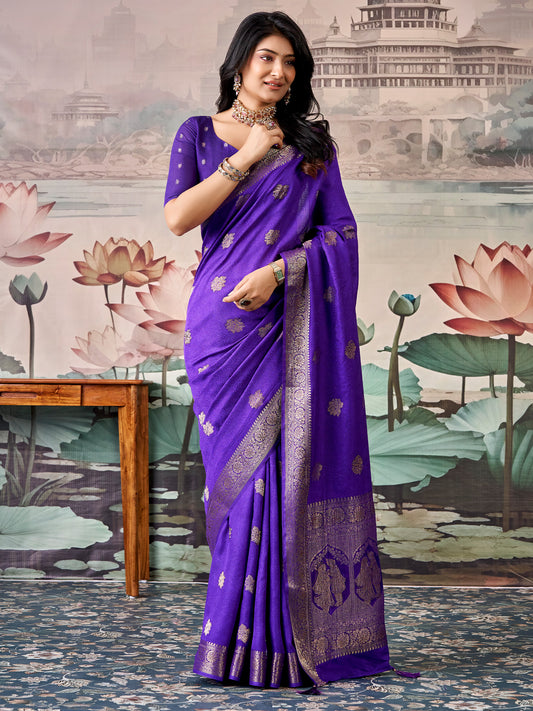 Woman wearing purple georgette saree with zari butta (metallic motif) work and purple blouse