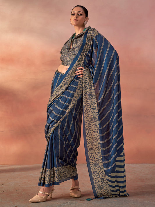 Woman wearing blue silk blend saree with traditional indian motif work and blue blouse