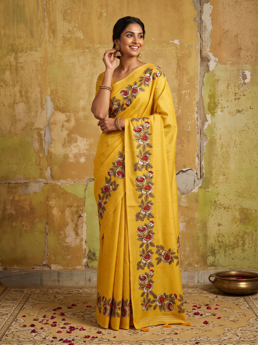 Woman wearing yellow dola silk saree with zari butta (metallic motif) work and yellow blouse