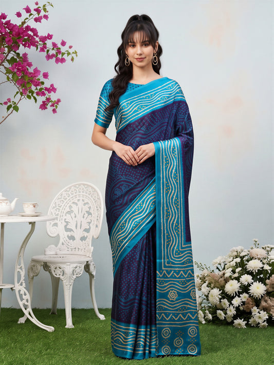 Woman wearing navy blue satin silk saree with bandhani tie-dye dot work and light blue blouse