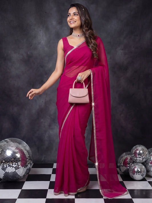 Woman wearing pink georgette saree with clean solid-tone finish and pink blouse