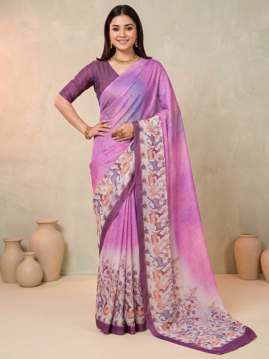 Woman wearing purple satin saree with animal-print design and purple blouse