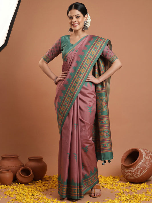 Woman wearing mauve silk blend saree with ikat resist-dyed pattern and teal green blouse