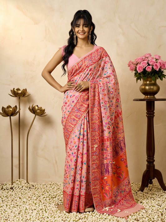 Woman wearing pink cotton silk saree with all-over floral design and pink blouse