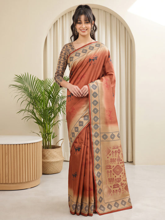 Woman wearing rust silk blend saree with tribal folk-art motifs and beige blouse