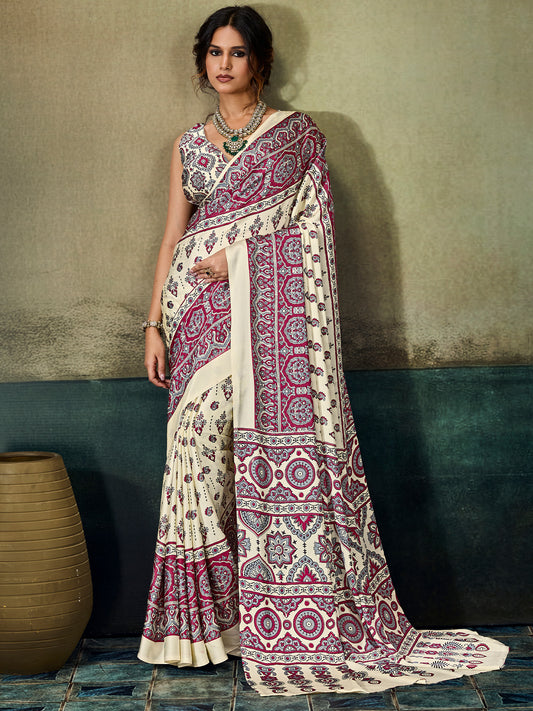 Woman wearing cream satin saree with ajrak block-print motif work and maroon blouse