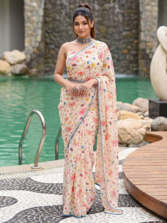 Woman wearing off white georgette saree with all-over floral design and off white blouse
