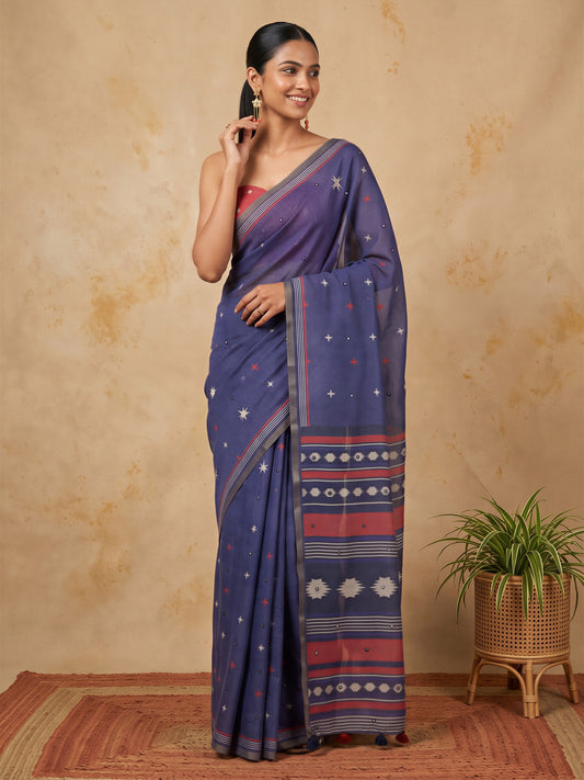 Woman wearing navy blue linen blend saree with geometric pattern design and orange blouse