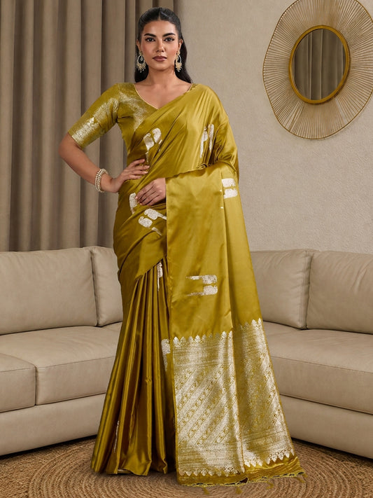 Woman wearing olive satin saree with botanical floral and leaf design and olive blouse