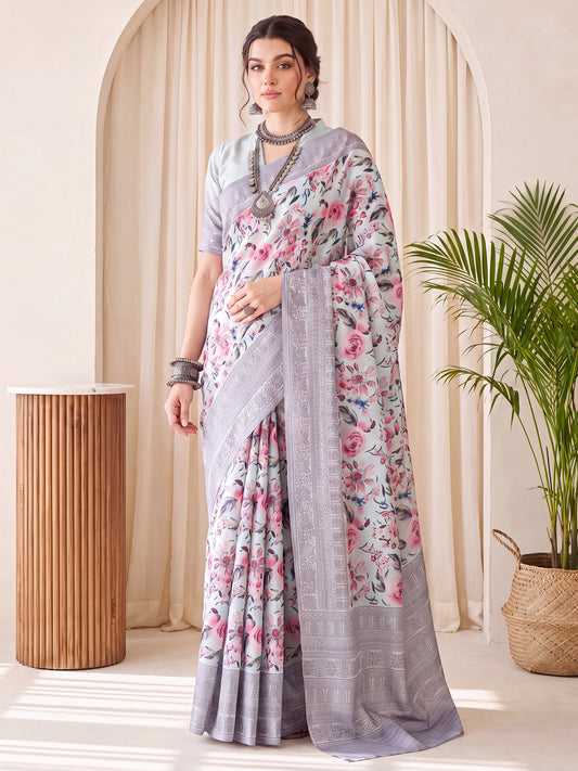 Woman wearing light blue silk blend saree with botanical floral and leaf design and light blue blouse