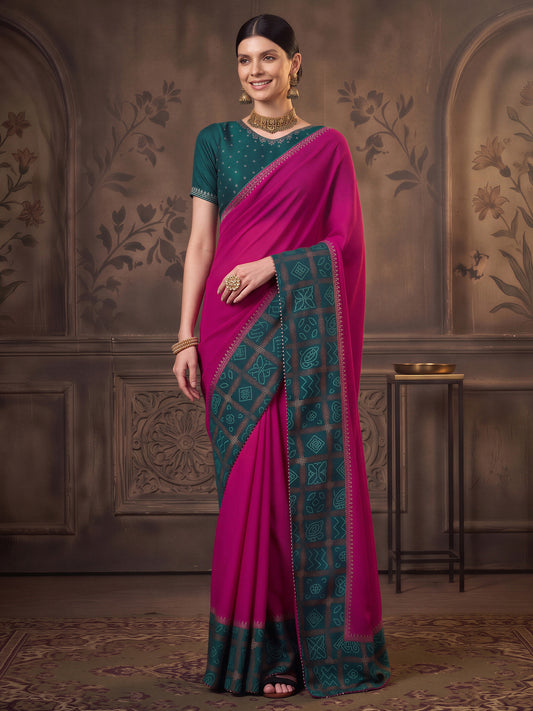 Woman wearing magenta vichitra silk saree with bandhani tie-dye dot work and teal blue blouse