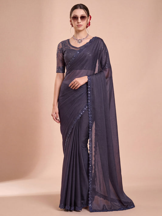 Woman wearing violet georgette saree with clean solid-tone finish and violet blouse