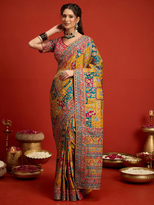 Woman wearing mustard silk blend saree with traditional indian motif work and pink blouse