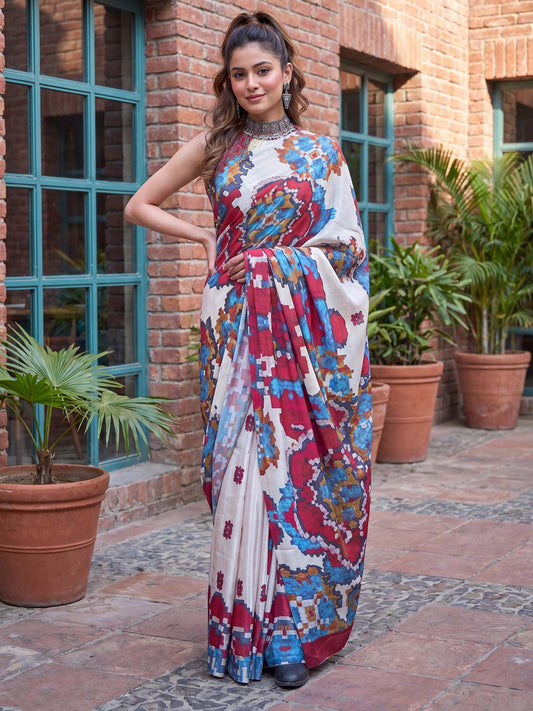 Woman wearing white pure crepe saree with abstract contemporary design and pink blouse