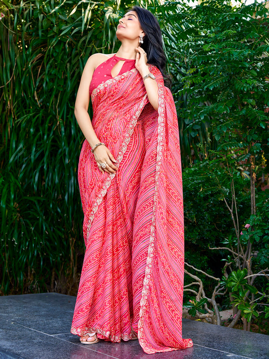 Woman wearing pink georgette saree with bandhani tie-dye dot work and pink blouse