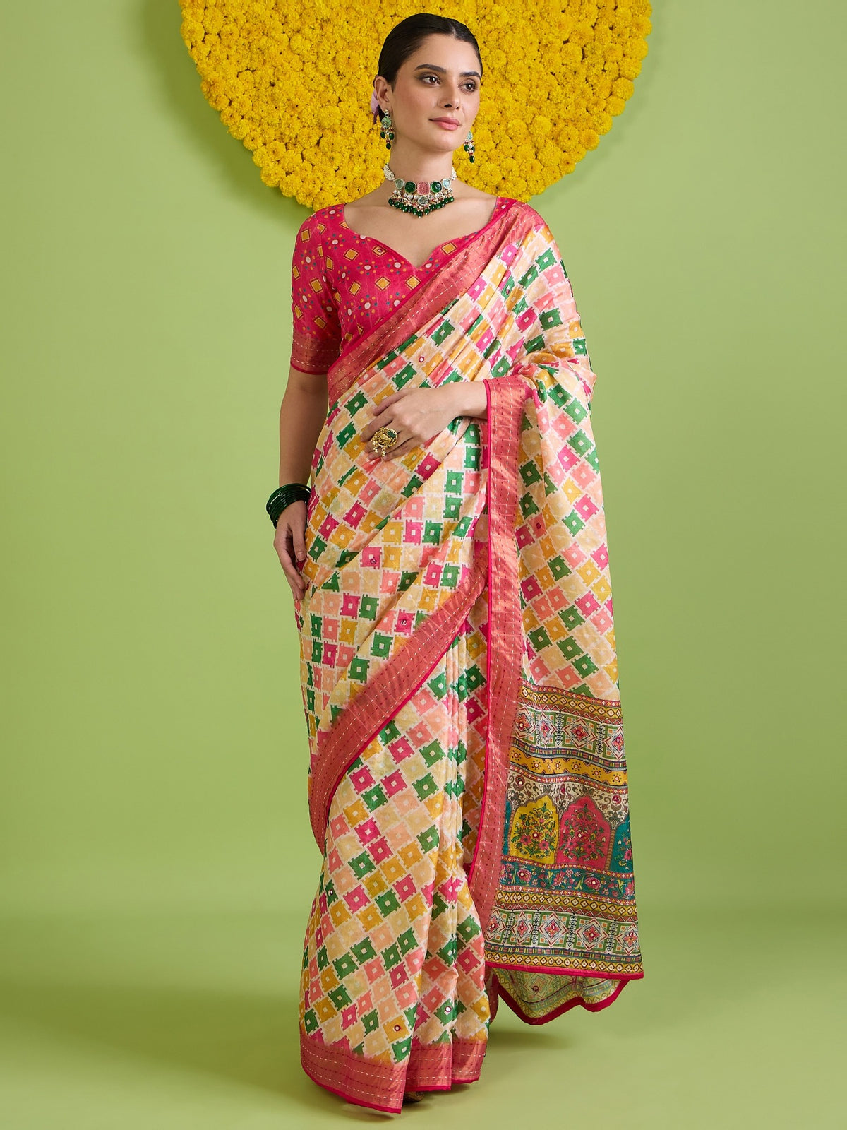 Woman wearing beige tussar silk saree with traditional indian motif work and pink blouse