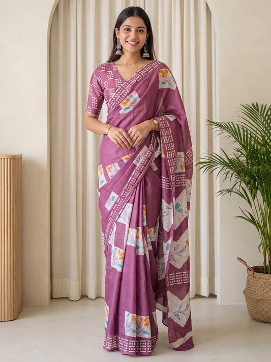 Woman wearing magenta cotton saree with traditional indian motif work and magenta blouse