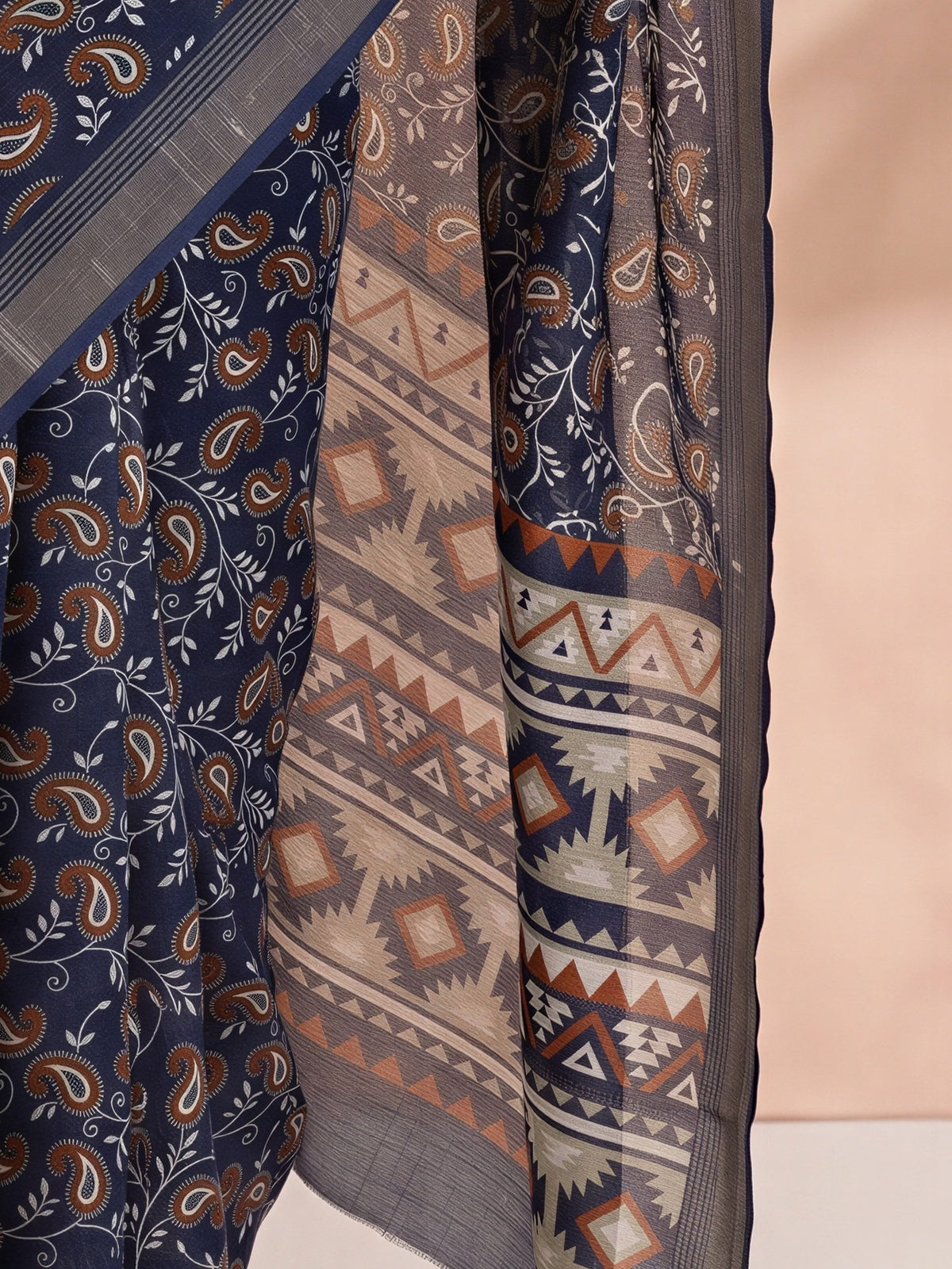 Pallu detail of navy blue cotton linen saree showing traditional indian motif work and zari border