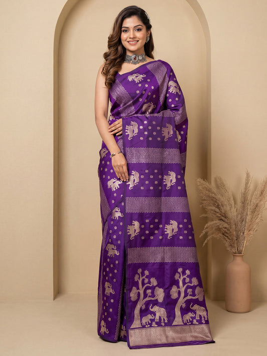 Woman wearing purple silk blend saree with zari butta (metallic motif) work and purple blouse