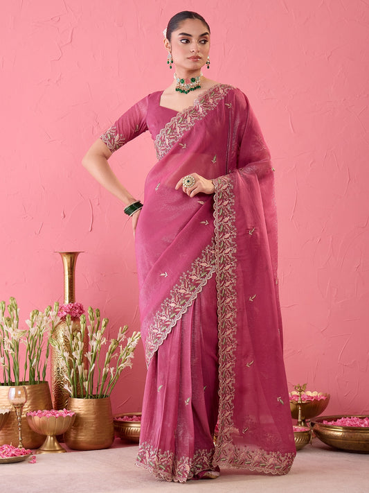 Woman wearing pink chiffon ready to wear saree with embroidered motif work and pink blouse