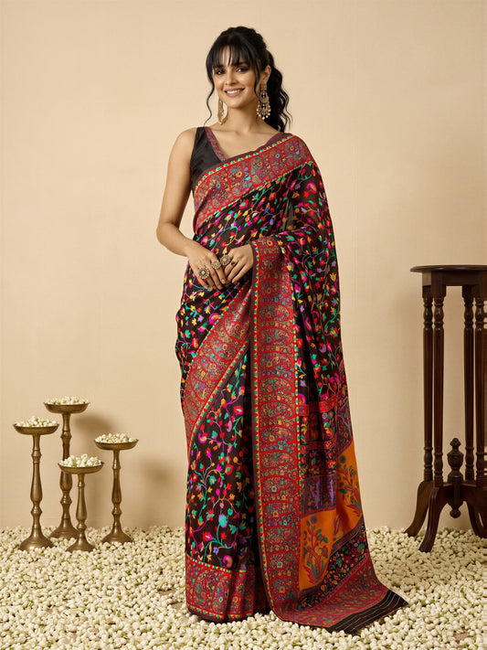 Woman wearing black cotton silk saree with all-over floral design and black blouse
