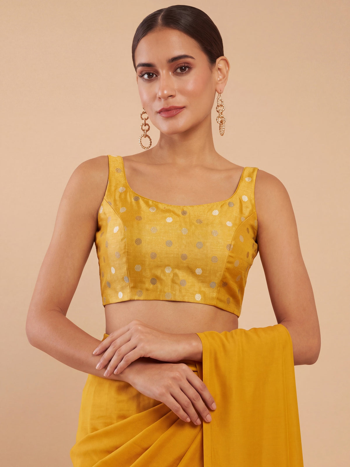 Yellow zari woven georgette sleeveless readymade saree blouse with round neck