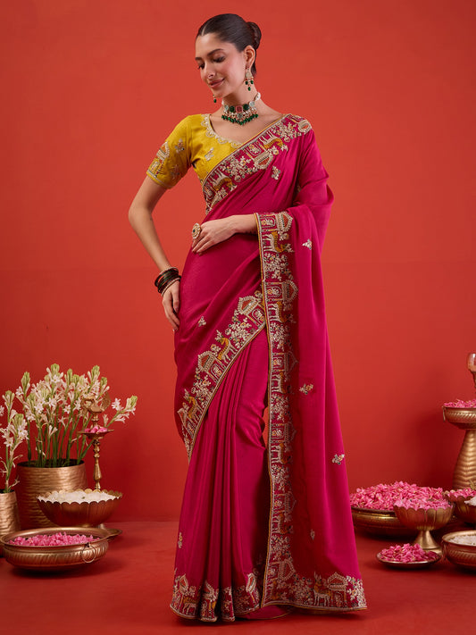 Woman wearing pink silk blend saree with embroidered motif work and mustard blouse