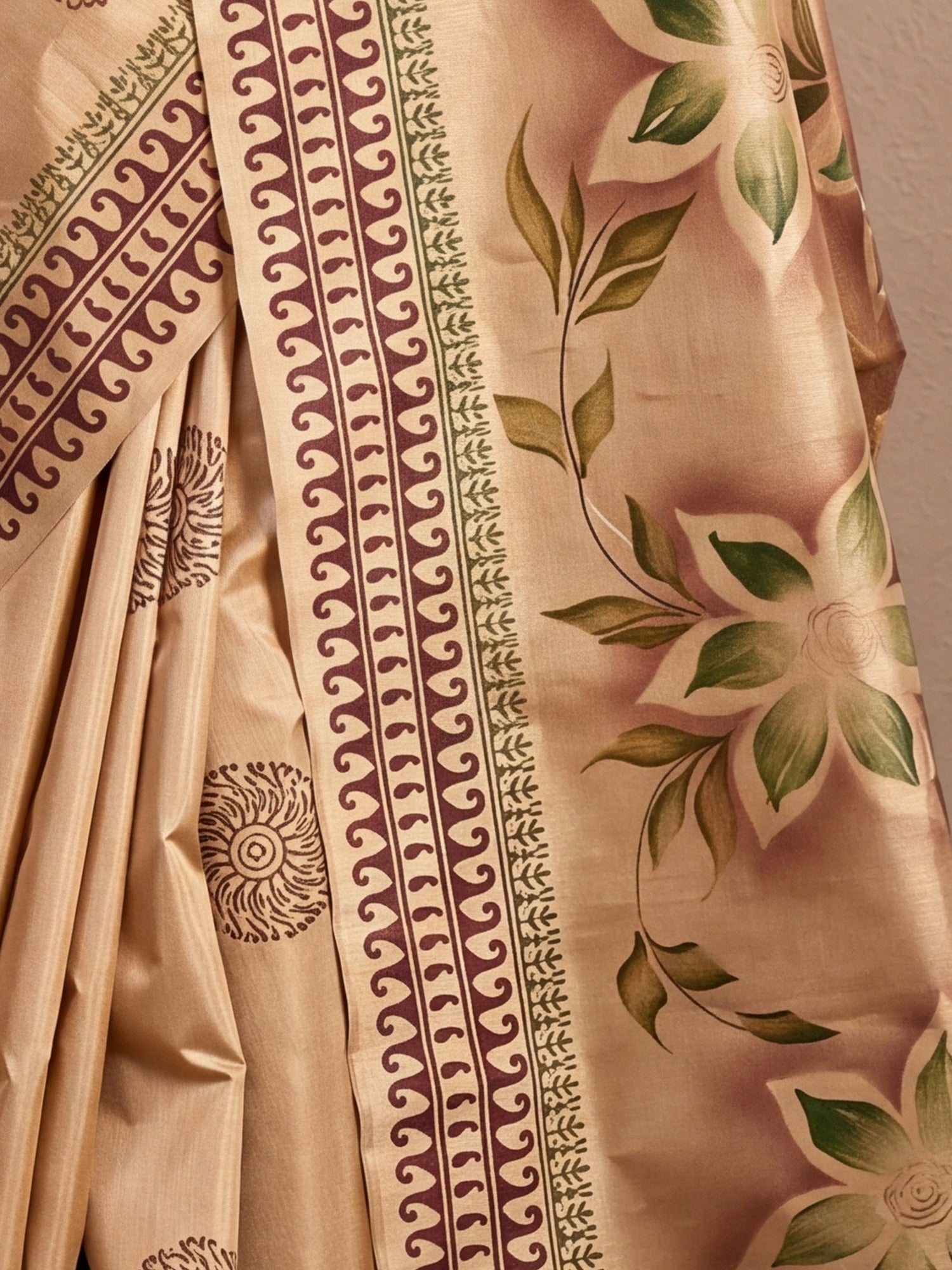 Pallu detail of beige silk blend saree showing hand-painted motif work and printed border