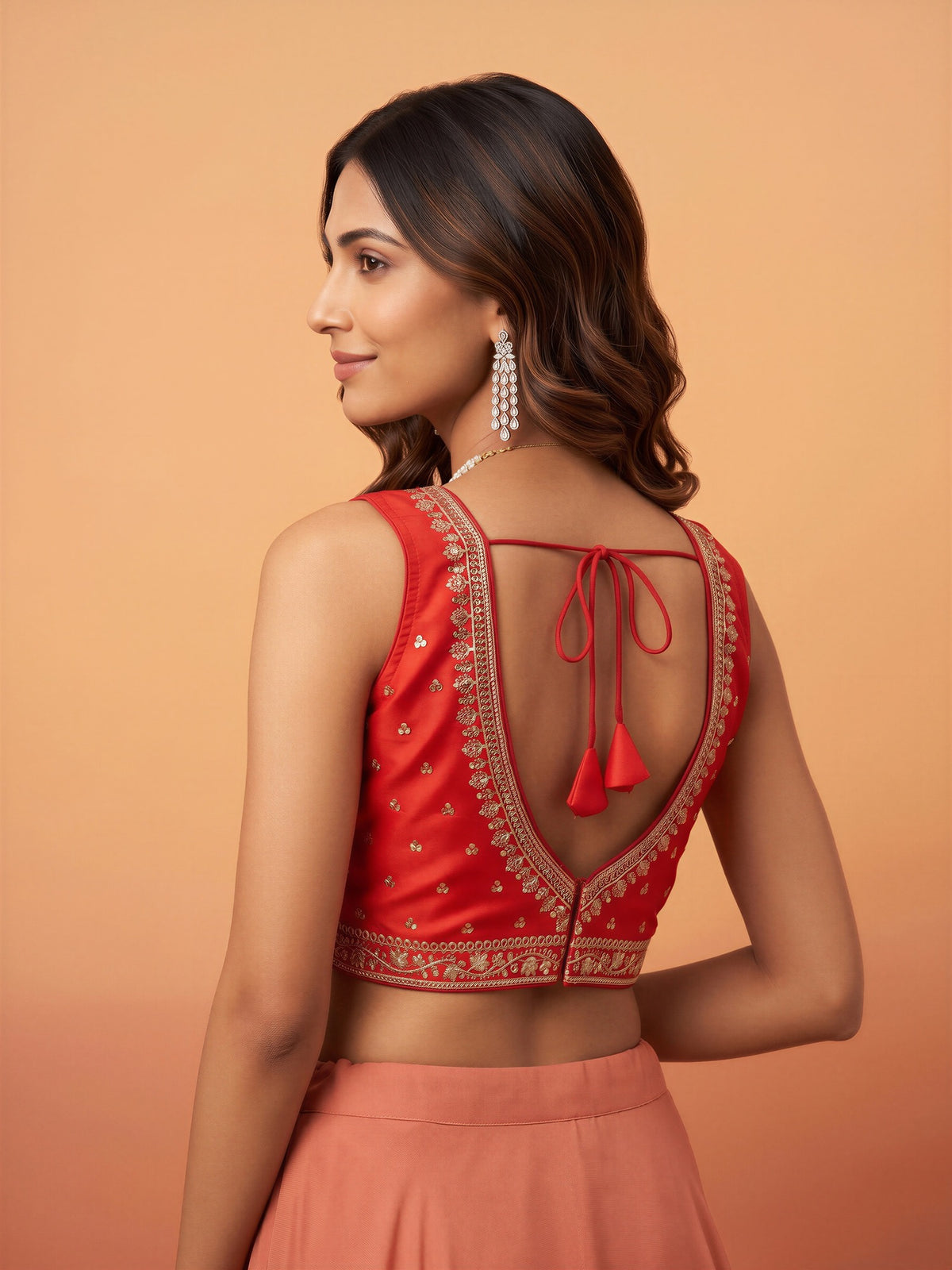Orange sequin embellished silk blend sleeveless readymade saree blouse with round neck view 1