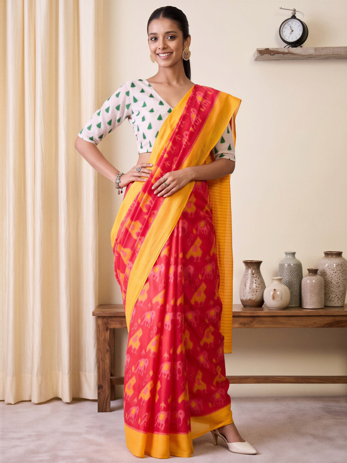 Woman wearing pink cotton blend saree with animal-print design and white blouse