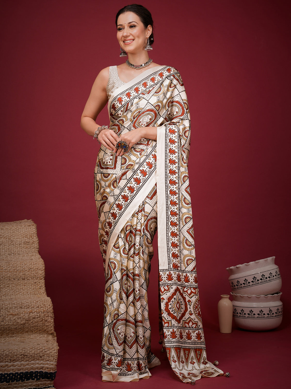 Woman wearing off white satin saree with ajrak block-print motif work and off white blouse