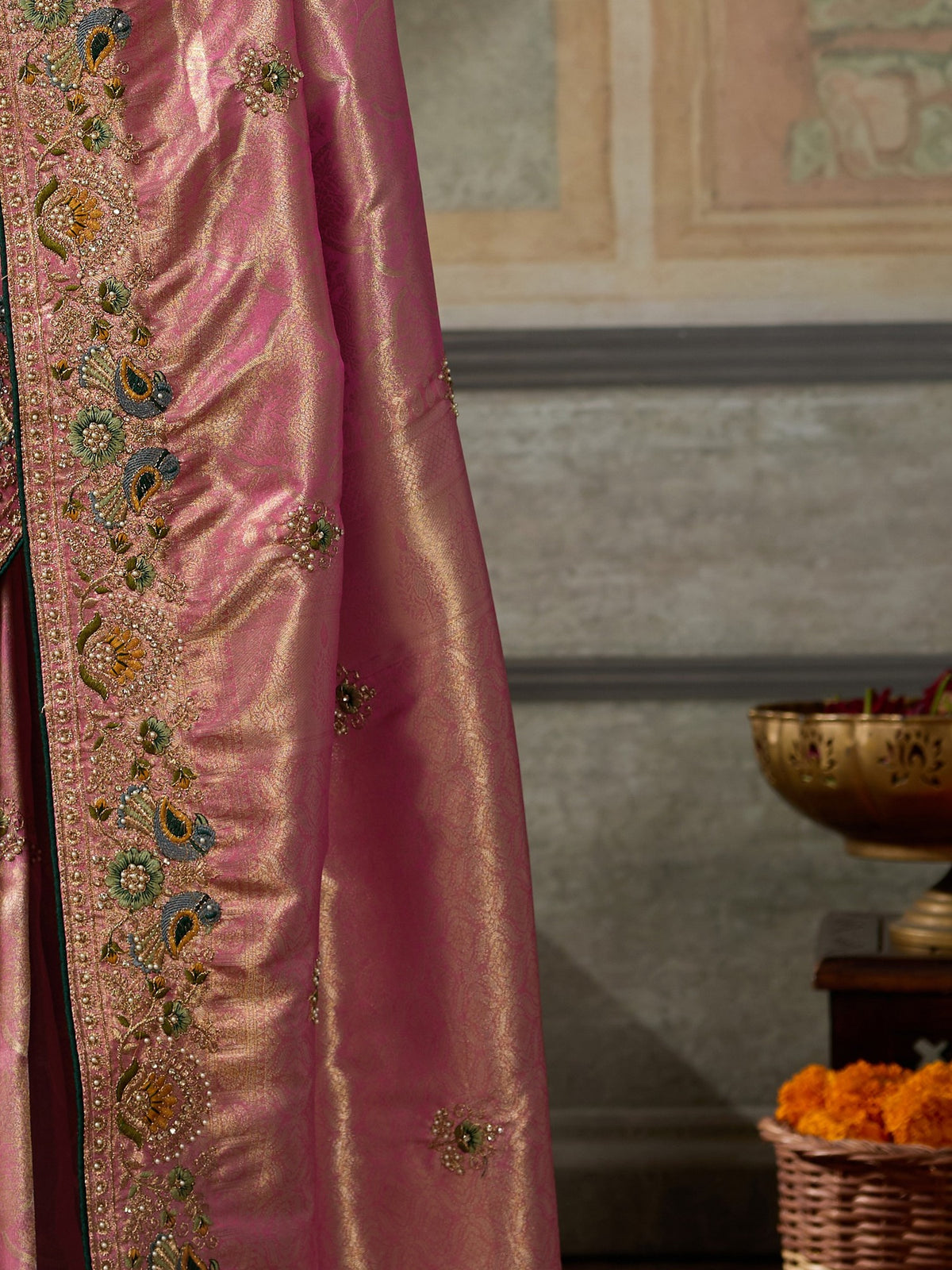 Pallu detail of pink silk blend saree showing ornamented surface design and embellished border