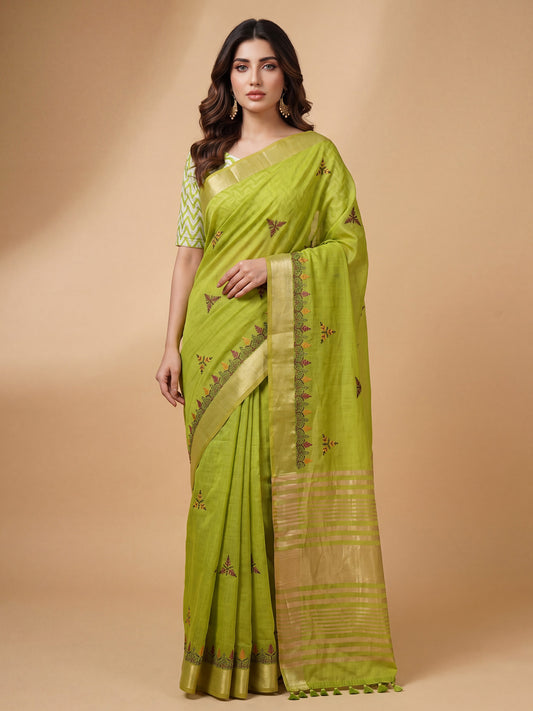 Woman wearing lime green cotton linen saree with embroidered motif work and lime green blouse