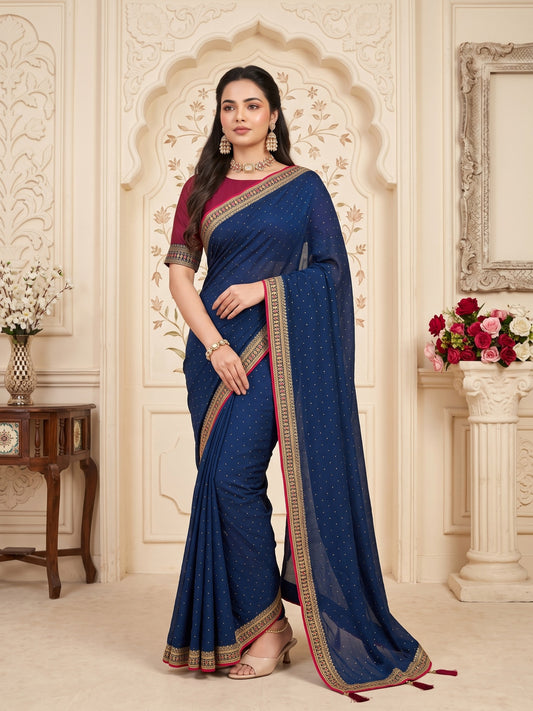 Woman wearing teal blue vichitra silk saree with ornamented surface design and pink blouse