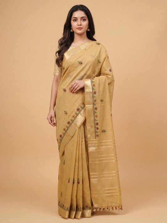 Woman wearing beige cotton linen saree with embroidered motif work and beige blouse