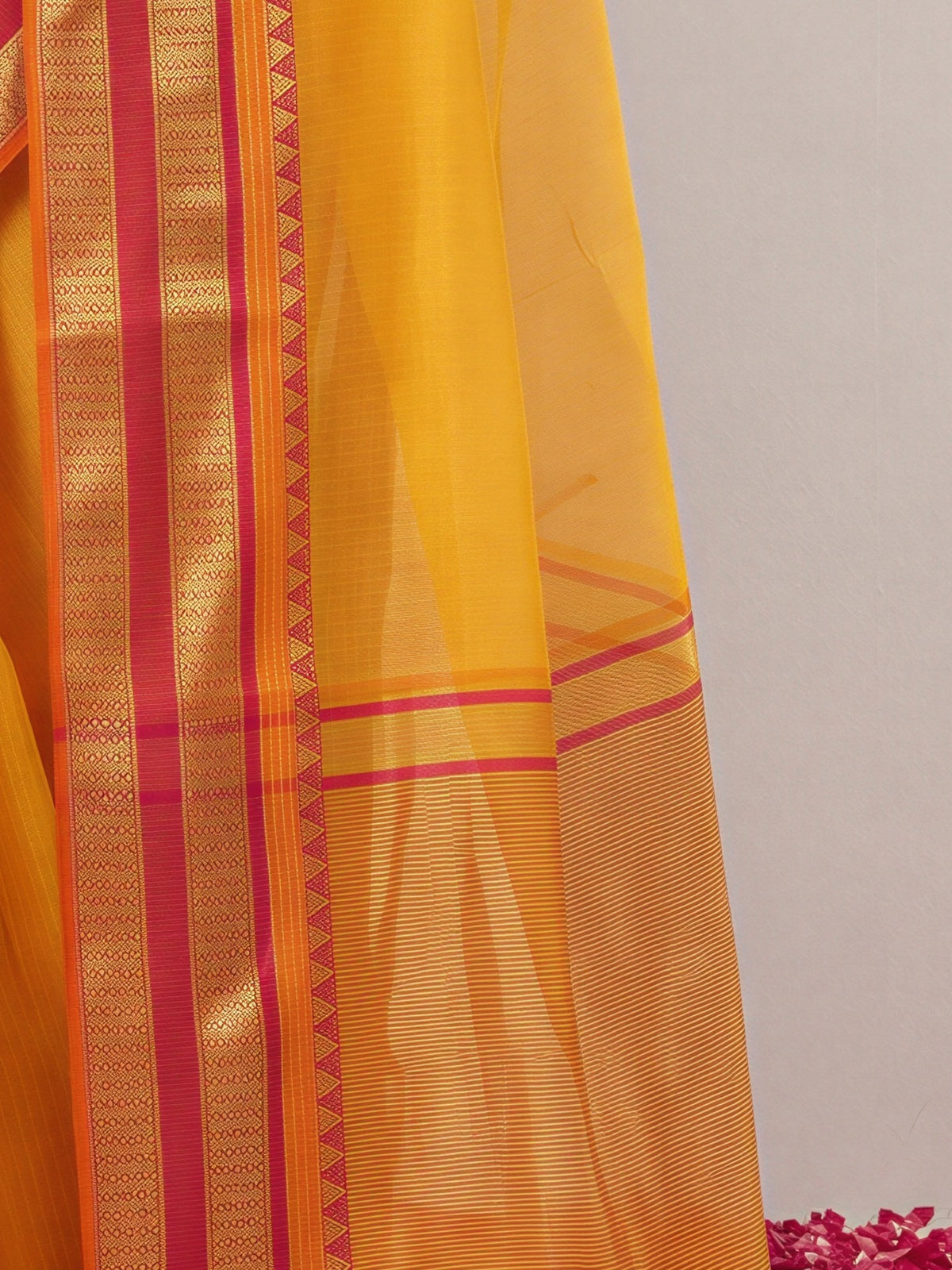 Pallu detail of mustard kota doria cotton saree showing clean solid-tone finish and zari border
