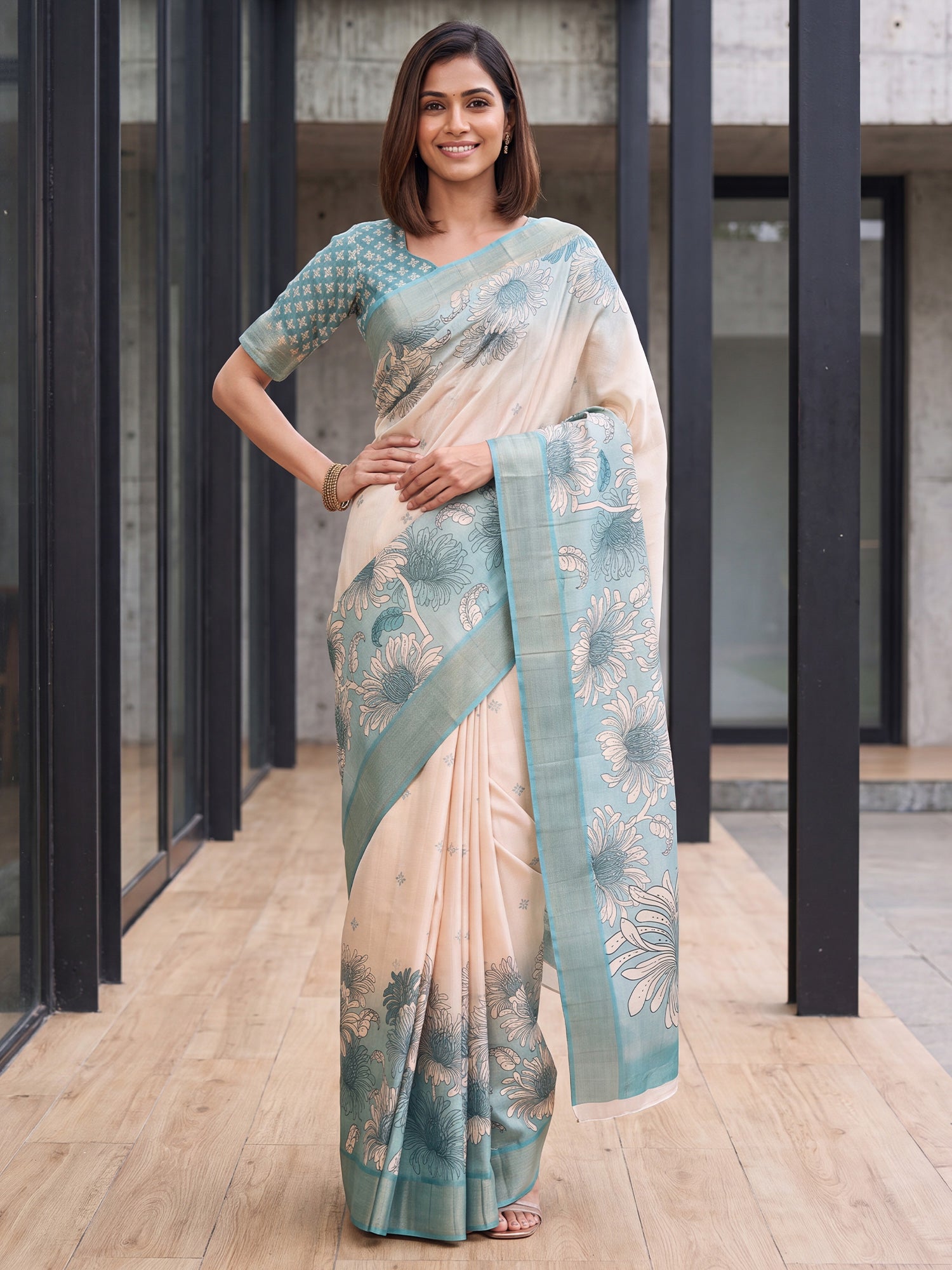 Woman wearing white satin silk saree with traditional indian motif work and light blue blouse