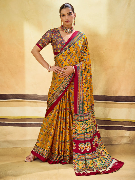 Woman wearing mustard satin saree with ajrak block-print motif work and mustard blouse