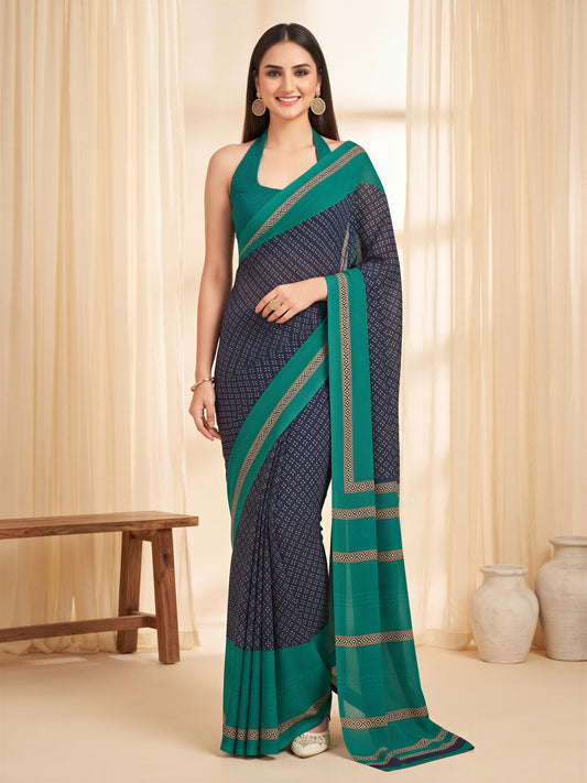 Woman wearing navy blue crepe saree with paisley (kairi) motif work and teal blue blouse