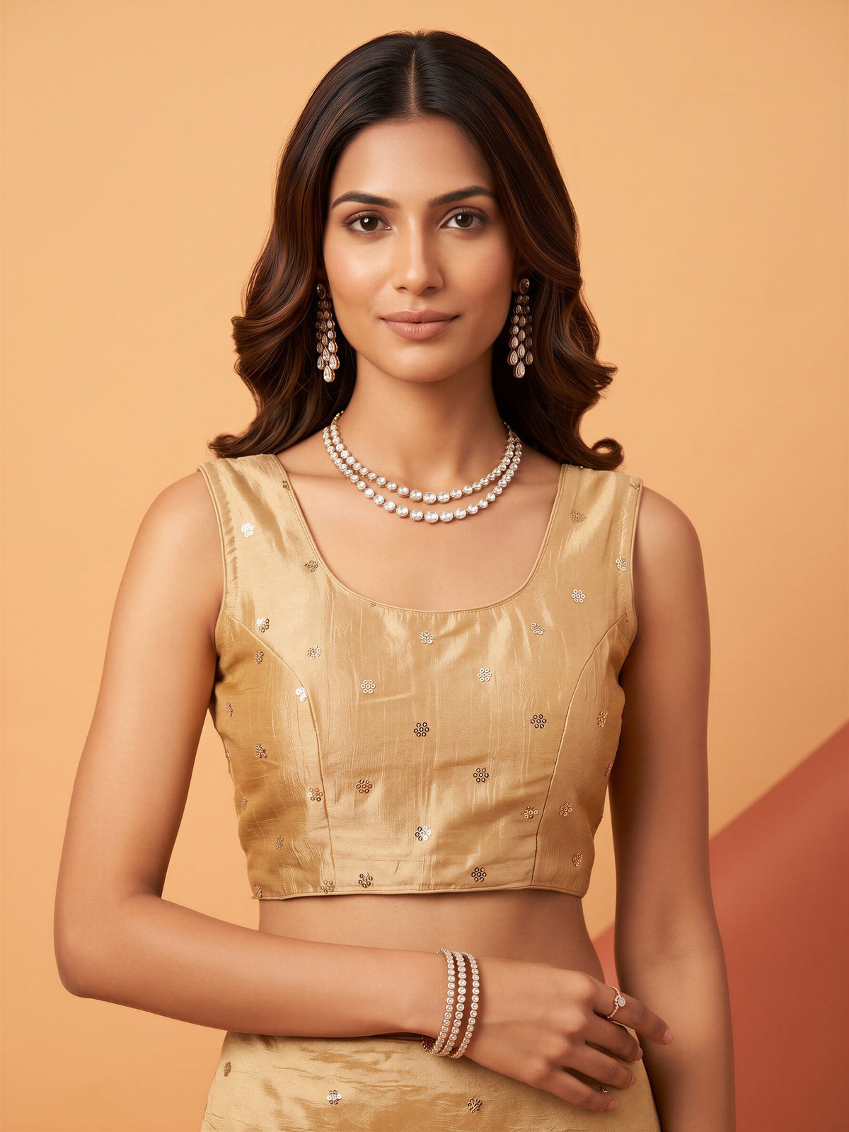 Cream sequin embellished chinnon sleeveless readymade saree blouse with round neck