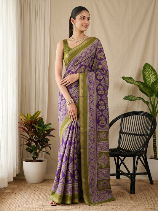 Woman wearing purple georgette saree with traditional indian motif work and olive blouse
