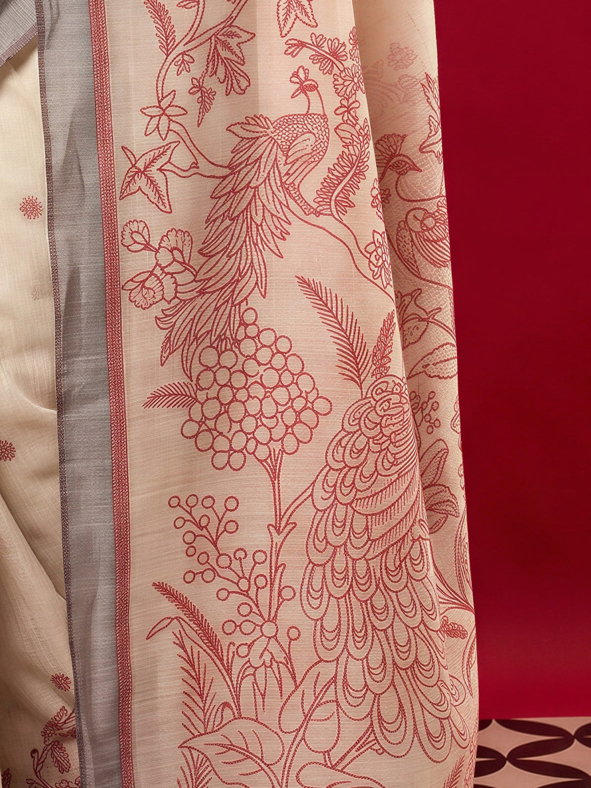 Pallu detail of beige silk blend saree showing woven motif design and woven design border