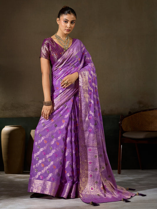 Woman wearing lavender georgette saree with woven motif design and wine blouse